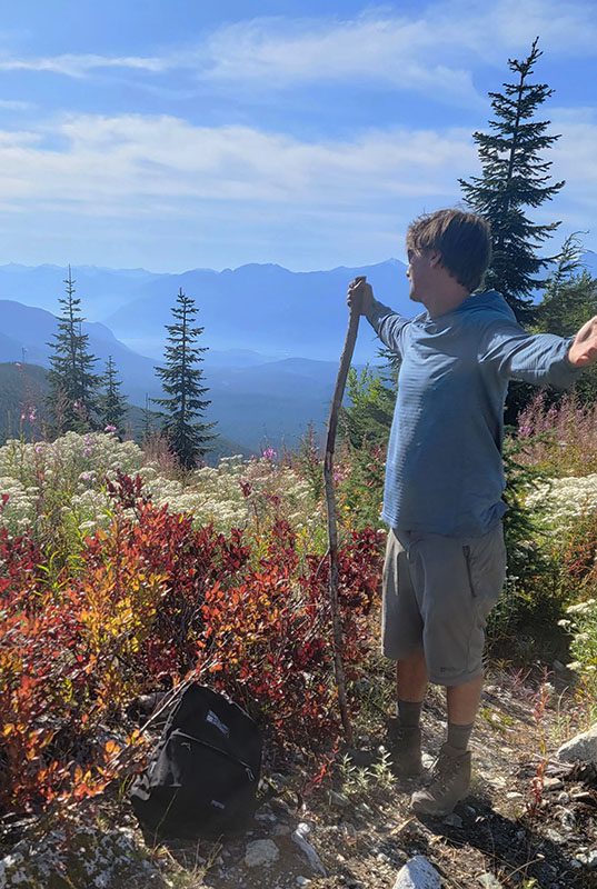 Steve Andrews looking over a scenic mountain viewpoint for his about me page.